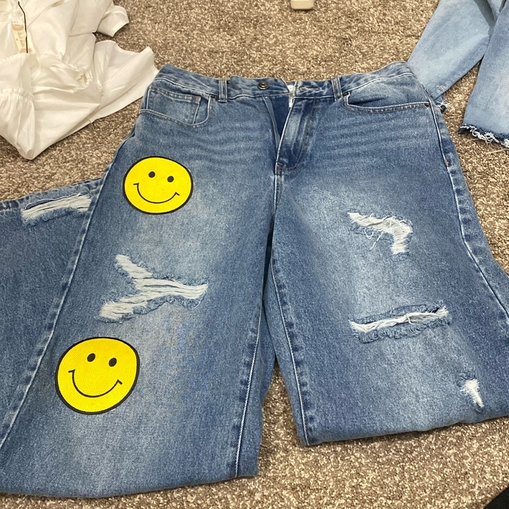 Distressed happy face embroidered jeans!